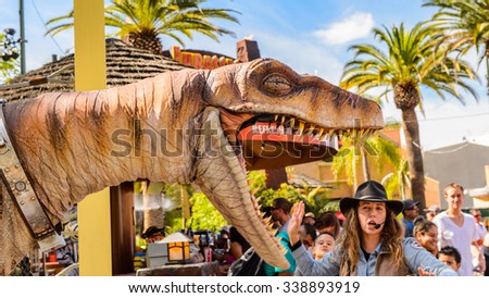 LOS ANGELES, USA - SEP 27, 2015: Realistic velociraptor in Jurassic Park area in the Universal Studios Hollywood Park. Jurassic Park is a 1993  adventure film  by Steven Spielberg
