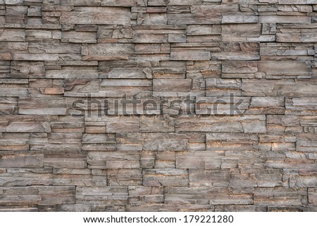 Dark grey stone tile texture brick wall surfaced.