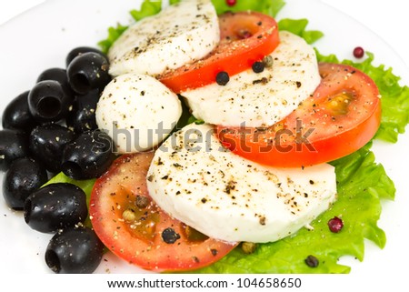 salad of mozzarella, tomatoes, olives and seasoning