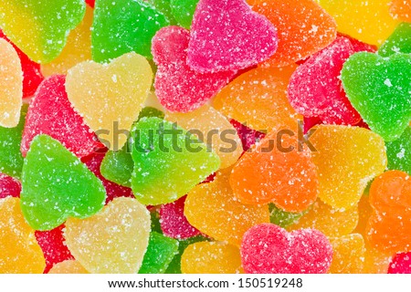Colorful fruit candy in sugar in the form of hearts