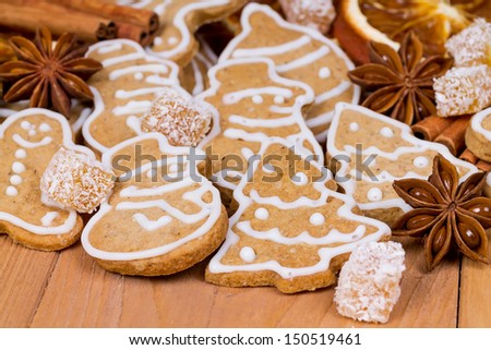 Christmas cookies of different shapes, cinnamon sticks, star anise and candied