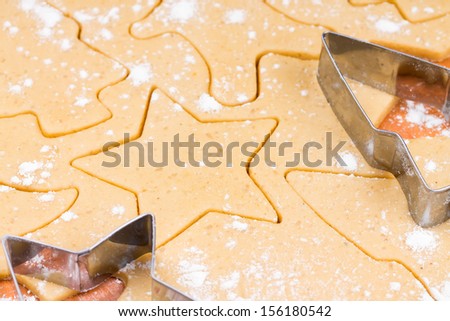 The process of baking Christmas cookies. Cutting cookie molds.