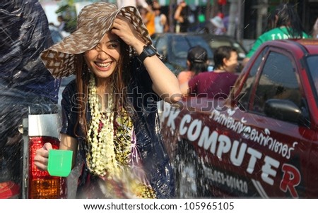CHIANG RAI, THAILAND - APRIL 14: Thai people splash water to bless good fortune and celebrate Thai New Year on April 14, 2012 in Chiang Rai, Thailand.