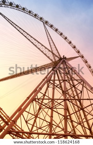 Ferris wheel during sunset glow.