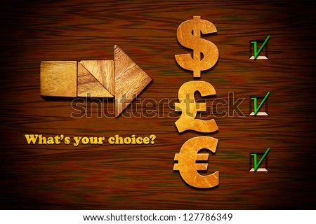 Wooden arrow with currency symbols. Low-key image