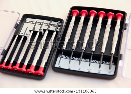 Precision screwdrivers in plastic boxes.