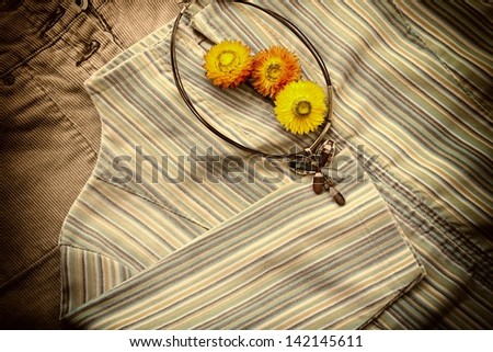 Close-up of women\'s shirt, skirt. Sepia image.
