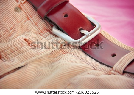 Corduroy skirt with leather belt.