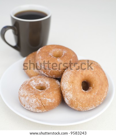 stock photo Donuts with coffee on a Linen background