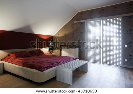 Interior Of New Bedroom In Daylight With Big Window Sto