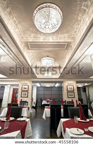 Interior of beautiful luxury restaurant with crystal chandeliers