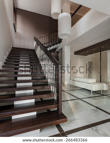 Luxury hall with staircase in modern style