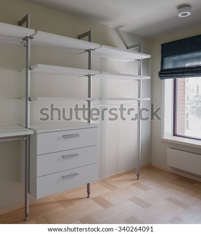Interior of modern empty wardrobe room with window