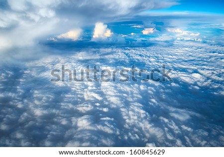 Looking down through the clouds to planet earth.
