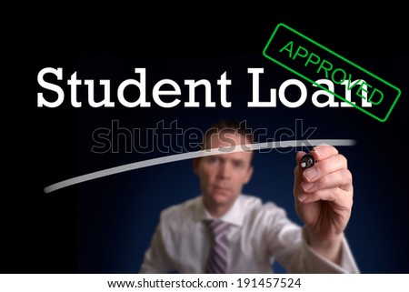 An underwriter writing Student Loan approved on a screen.