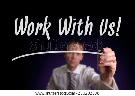 A businessman writing Work With Us on a screen. Employment Concept