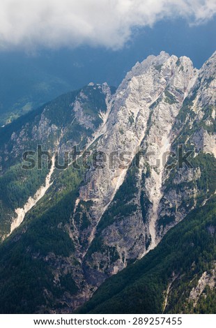 A cloud topped mountain in the Julian Alps in Slovenia as poor weather moves in