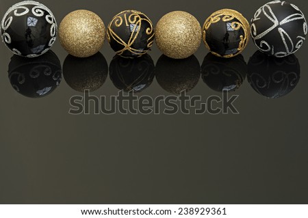 black and gold christmas balls on black background