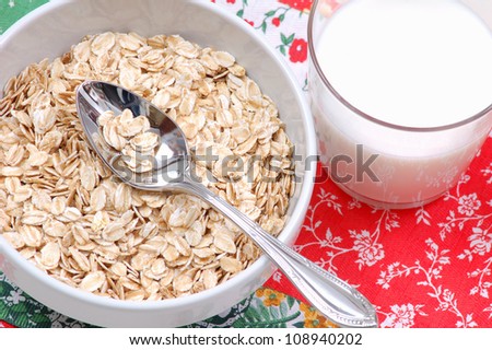Oatmeal and glass of milk. Healthy breakfast concept, dieting food.Whole foods.