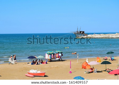 ITALY, AUGUST 19: Beach with umbrellas on summer day.Beach near Vieste with umbrellas, southern Italy, Apulia, Italy,August 19, 2013.Vieste has received Blue Flags for the purity of its waters