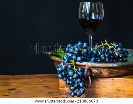Red wine glass.Wine and grape, rustic wood background,winery.