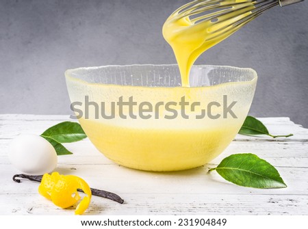 Custard pastry cream. Preparation of sweet cream in a bowl with lemon and vanilla.Pastry filling.