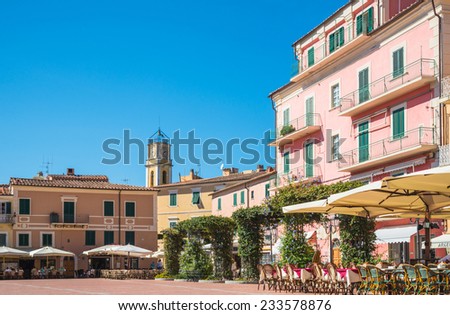 Elba Island, Italy - 28 Sept. 2014:Panoramic view of center of Porto Azzurro village. Main square Piazza Matteotti, picturesque square facing sea, Elba, Tuscany, Italy on 28 Sept. 2014
