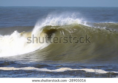 huge wave breaking near the shore