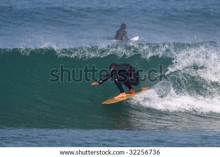 good surfer in action on a beautiful wave