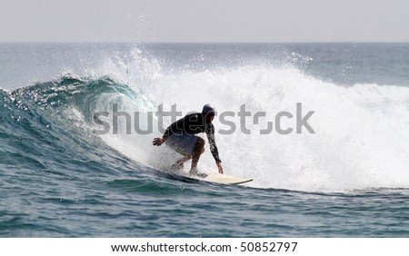 good surfer in action on a nice tropical wave