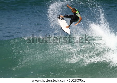 good surfer in action on a powerful wave