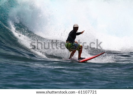 good surfer in action on a huge wave