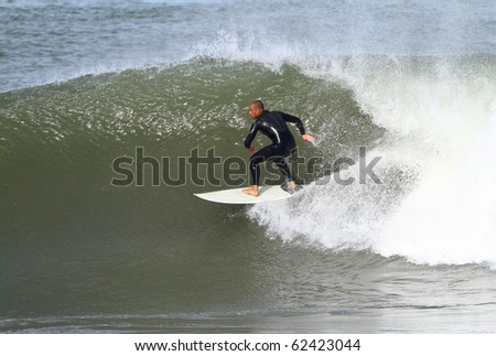 good surfer in action on a powerful wave