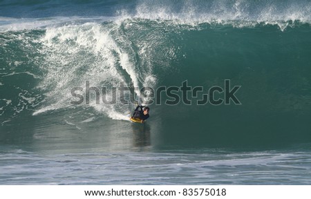 body board on a big wave