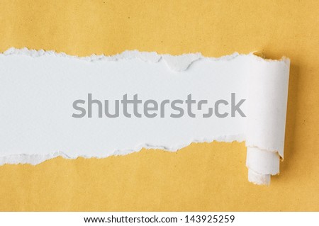 Yellow paper torn into two pieces apart.