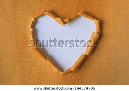 Recycled paper Orange. Torn heart. Paper crafts.
