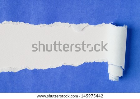 Blue paper torn into two pieces apart.