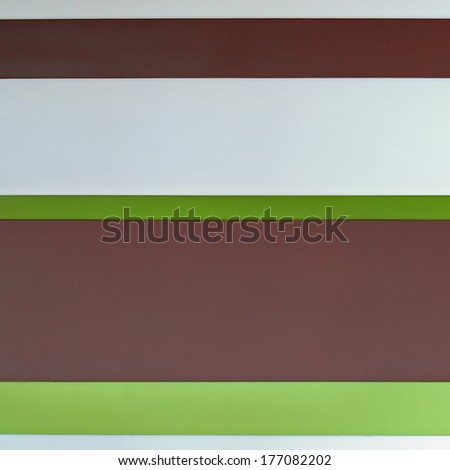 Wood flooring in brown, white and green. Background.