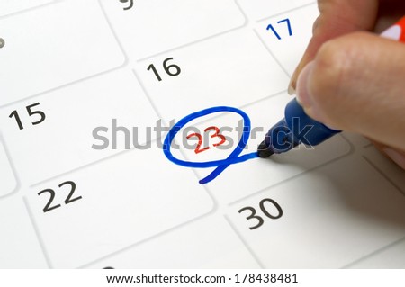 Calendars are drawn circle at 23 with a blue pen.
