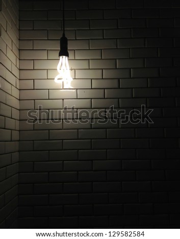 Old white ceramic wall background texture with a dark light from bulb
