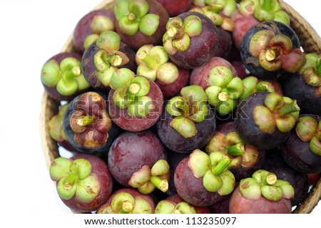 Mangosteen is the Queen of Thai Fruits. Mangosteen is the Queen of Thai Fruits in bamboo basket on white background