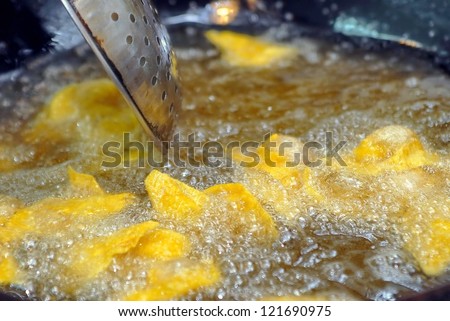 Fry the dumplings in hot pan. Pan fried dumplings are boiling hot oil.