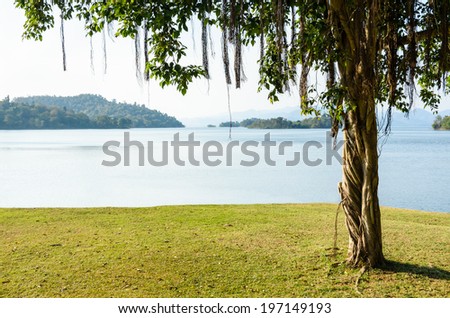Landscaped lawns for relaxing waterfront under the tree at Kaeng Kra Chan National Park in Phetchaburi Province, Thailand