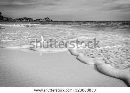 Black and white style, beautiful landscape sea sand and waves on the beach during summer at Koh Miang island in Mu Ko Similan National Park, Phang Nga province, Thailand