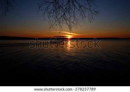 As the sun sets on the lake