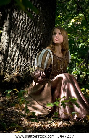 Beautiful princess in dark wood
