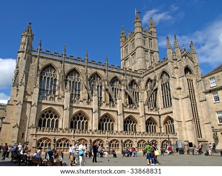 CITY OF BATH, ENGLAND - JULY 6: Tourists at the yard of the Bath Abbey, West England, July 6, 2009. The Bath Abbey is located near the famous Roman Bath Museum, a tourist attraction in this city.