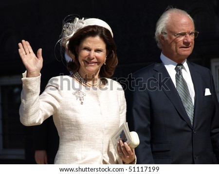 COPENHAGEN - APR 16: HRH Queen Silvia and King Harald of Sweden waves at the crowd during celebration of Queen Margrethe\'s 70th birthday on April 16, 2010 at Copenhagen City Hall in Copenhagen.