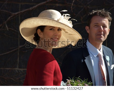 COPENHAGEN - APR 16: HRH Crown Prince Frederik and Princess Mary smile at the crowd in front of the Copenhagen City Hall during the celebration of Queen Margrethe\'s 70th birthday on April 16, 2010 in Copenhagen.