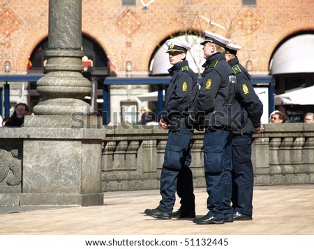 COPENHAGEN - APR 16:  Danish policemen guard and secure the Copenhagen City Hall during the celebration of Queen Margrethe\'s 70th birthday on April 16, 2010 in Copenhagen.